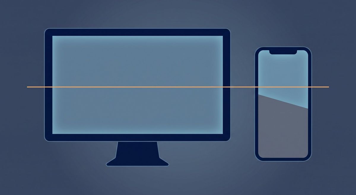 A wide desktop monitor glowing calm slate-blue beside a narrow smartphone, the two screens visibly unequal.