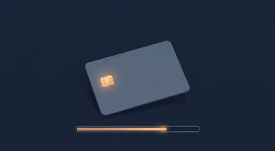 A plain credit card with an amber-lit chip above a thin progress bar showing a balance being drawn down.